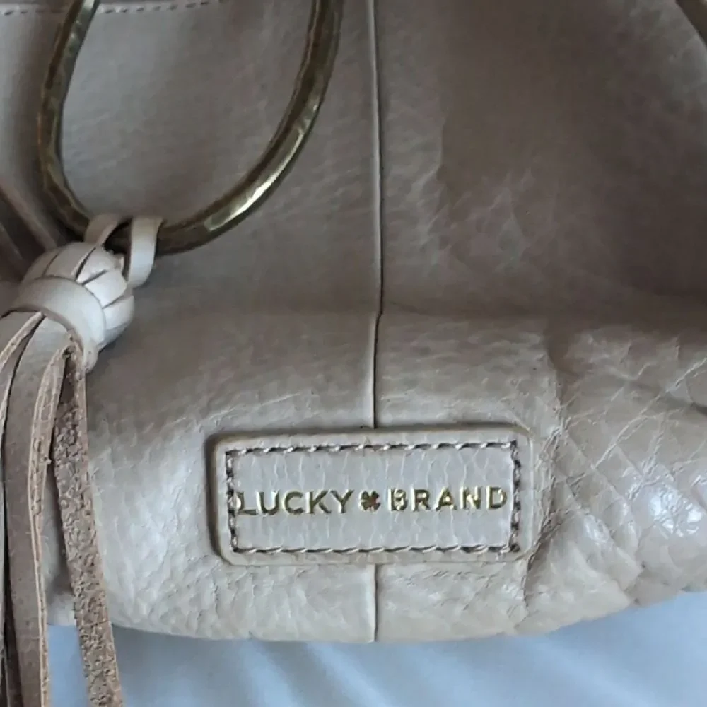 Lucky Brand Cream Colored Leather With Brass Ring/Tassel Crossbody Bag